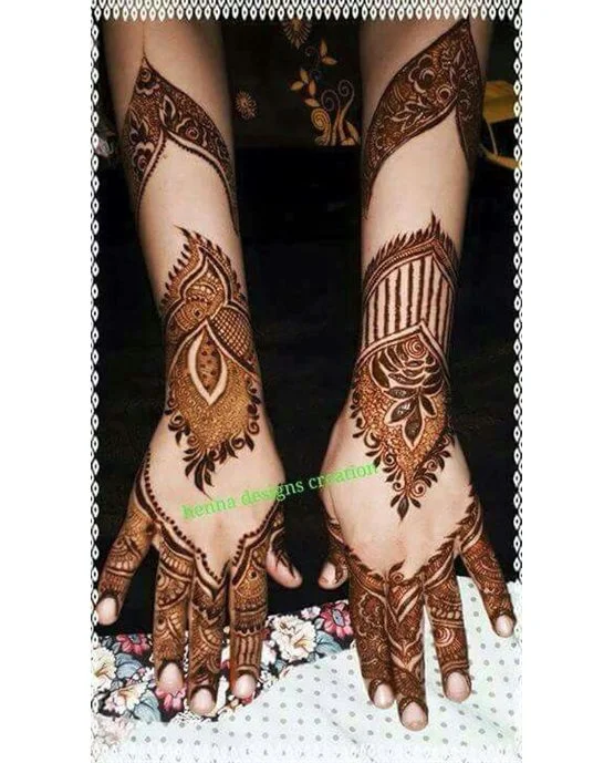 Peacock Swirl Symmetry On Back Hand Mehndi Design